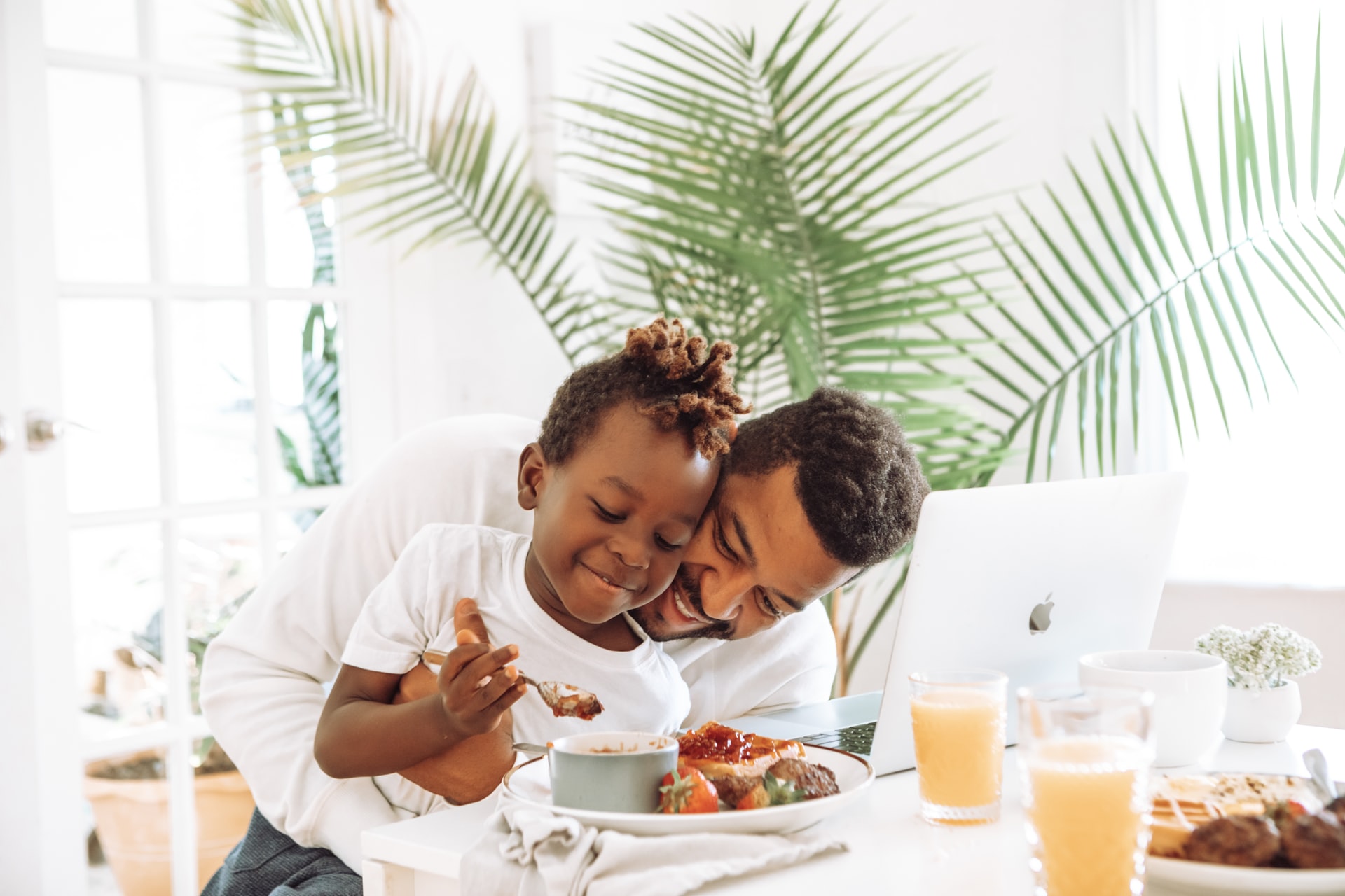 father and son eating breakfast together